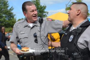 Police officers sharing laughs together during the Police Appreciation Cookout.