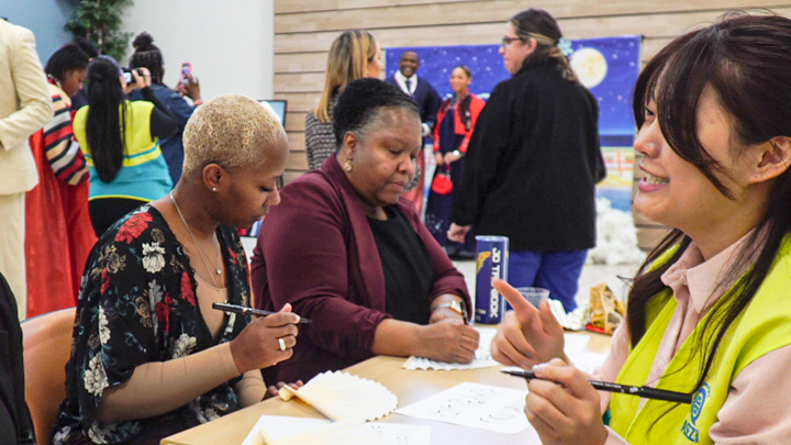 Korean cultural festival in Newport News featuring Hangul calligraphy practice